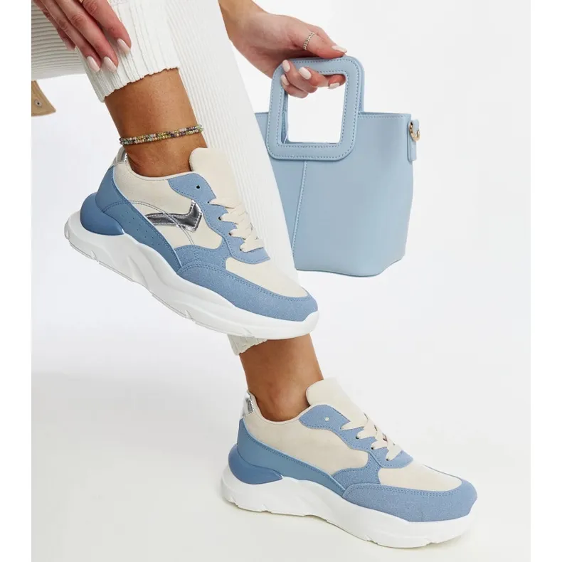 Beige and blue sneakers on the Nereida platform