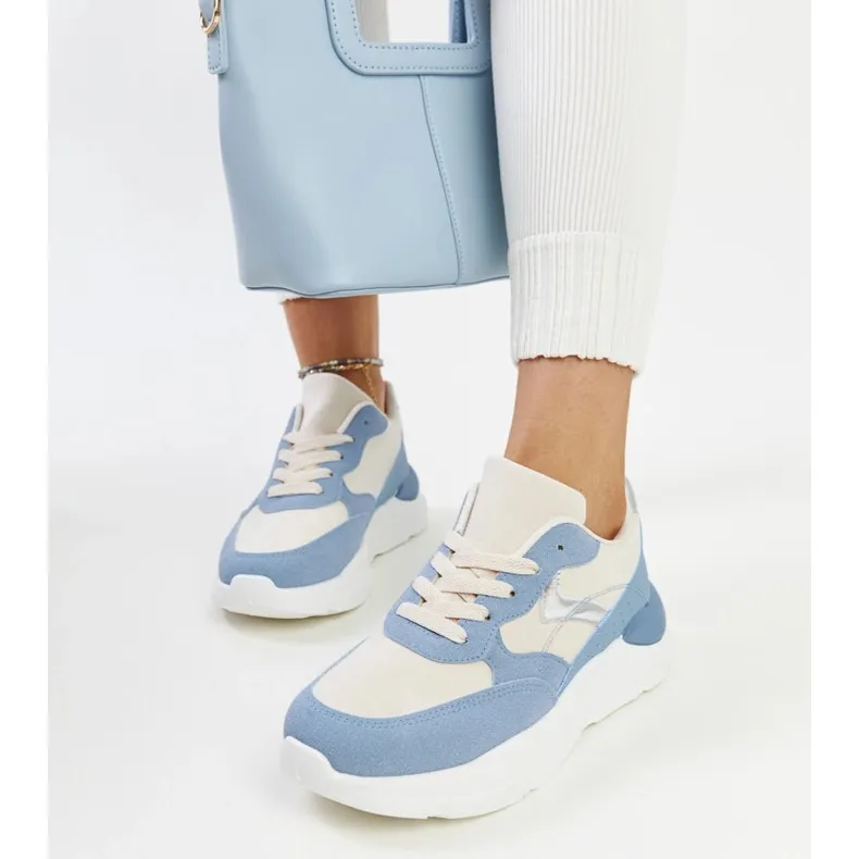 Beige and blue sneakers on the Nereida platform