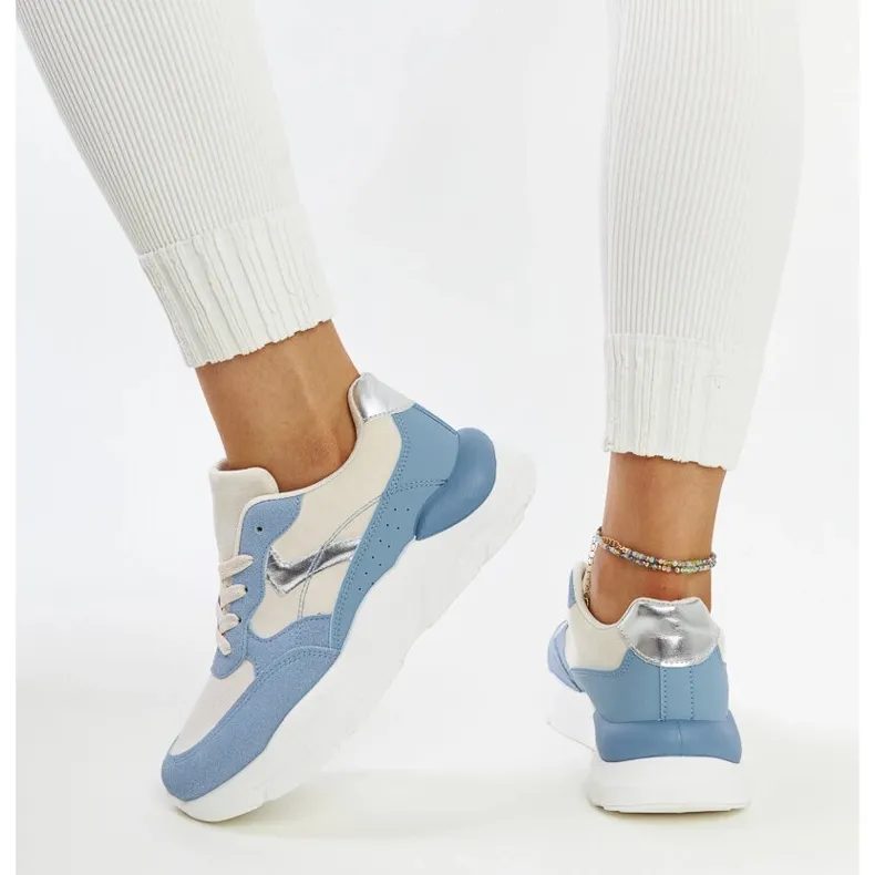 Beige and blue sneakers on the Nereida platform