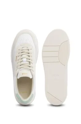 Branded lace-up trainers in leather and nubuck