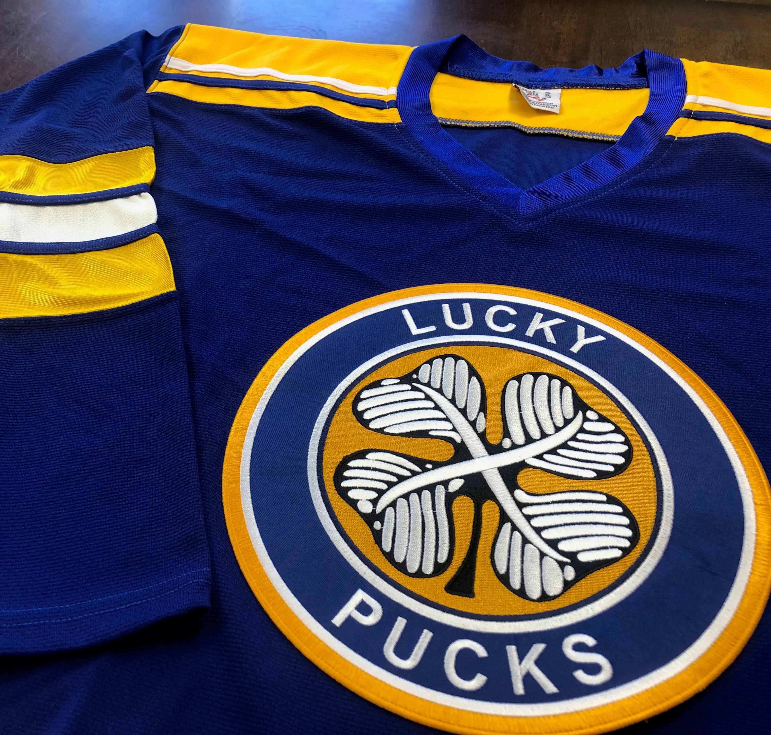 Custom Hockey Jerseys with a Lucky Pucks Embroidered Twill Logo