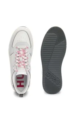 Mixed-material trainers with two sets of laces